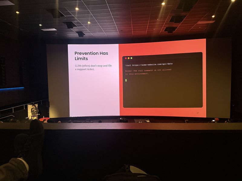 Slide: Prevention Has Limits shows an agent hitting a curl block error, illustrating that LLMs do not file support tickets when blocked
