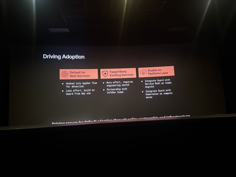 Slide: Driving Adoption outlines three strategies: default Guard for new services, target risky existing services, and enable Guard at the platform layer